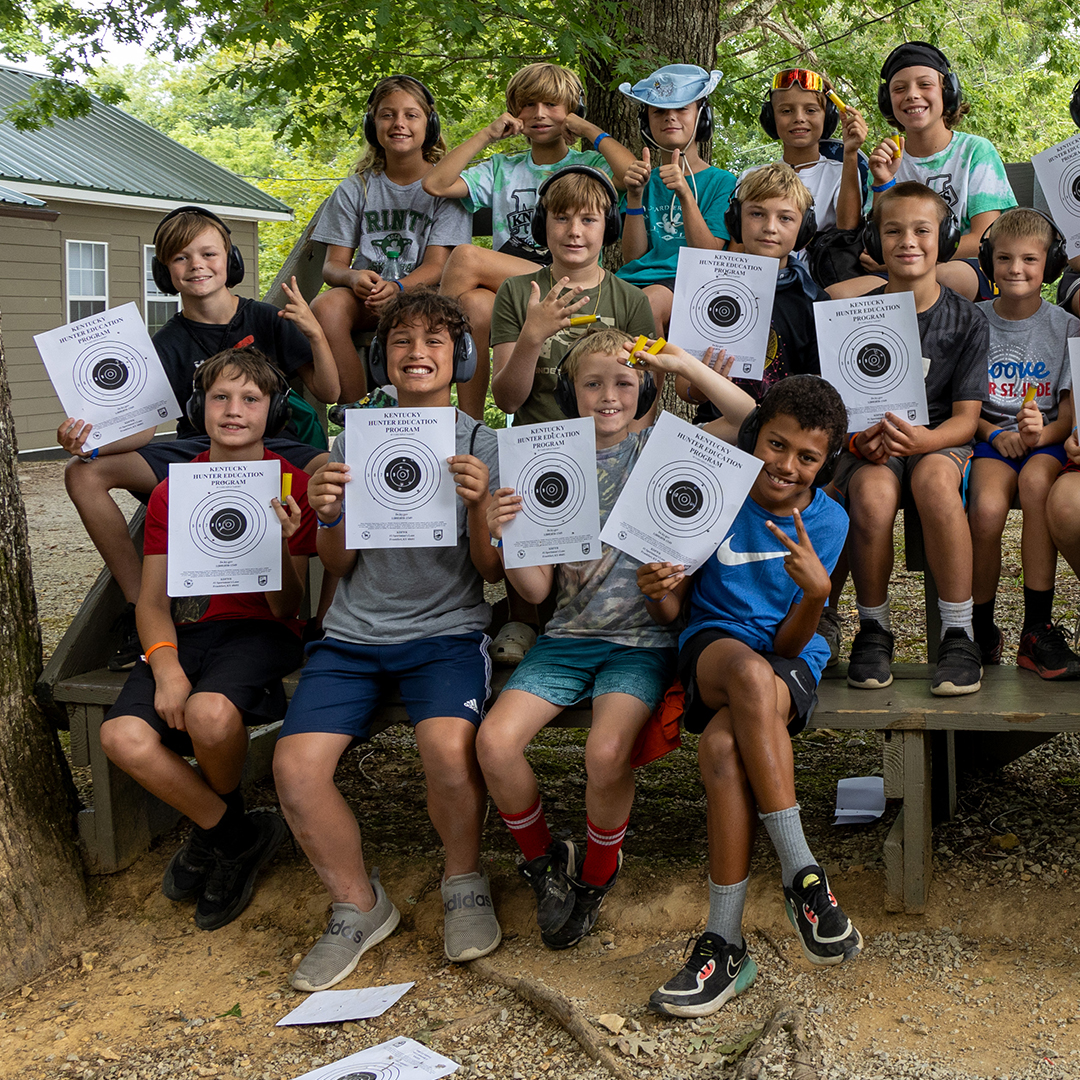 campers holding up target signs